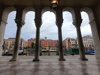 Buildings seen through colonnade