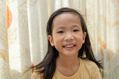 Portrait of cute girl smiling