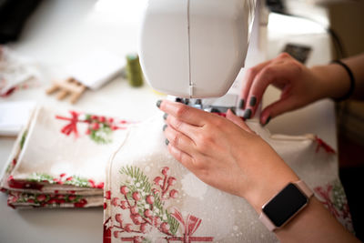 Cropped hands sewing machine