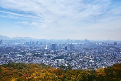 High angle view of city buildings against sky