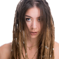 Close-up portrait of a beautiful young woman over white background