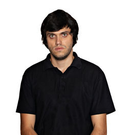 Portrait of young man standing against white background