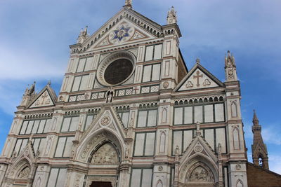 Low angle view of ornate building against sky