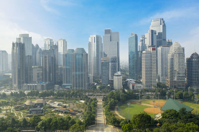 Modern buildings in city against sky