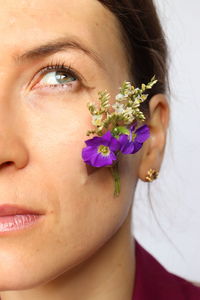 Face of woman with natual flowers