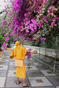 Woman walking on footpath