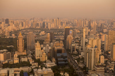 High angle view of modern buildings in city against sky