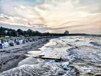 Scenic view of beach against sky during sunset