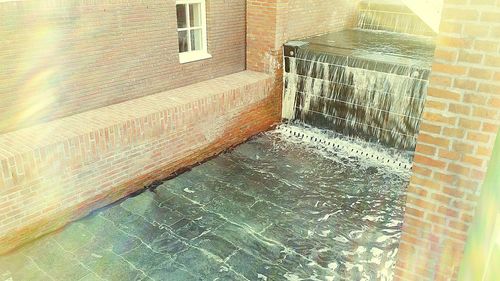 High angle view of swimming pool by building