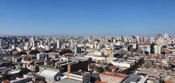 High angle view of buildings in city against clear sky