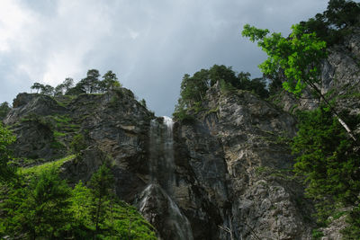 Low angle view of rocks against sky