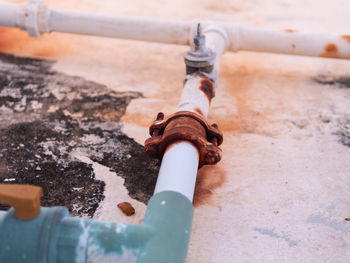High angle view of water pipe on metal