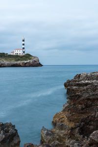 Scenic view of sea and rocks against sky
