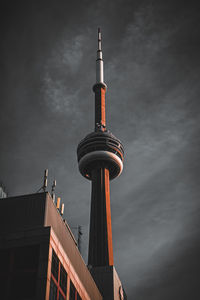 Low angle view of building against sky and cn tower