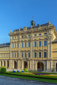 Low angle view of historical building against clear blue sky