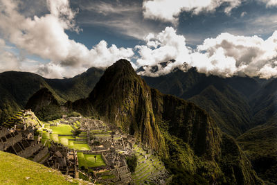 Panoramic view of a mountain range against cloudy sky