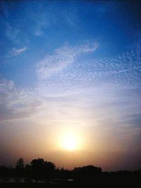 Scenic view of landscape against sky at sunset