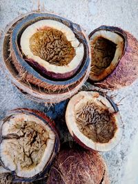 Close-up high angle view of coconuts on rock