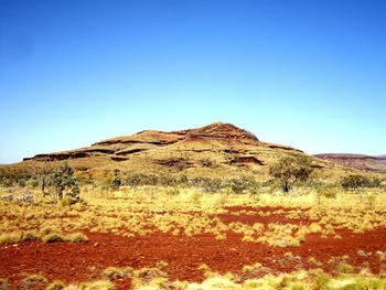 Scenic view of mountain against clear blue sky