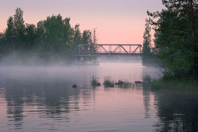 View of bridge over lake against sky