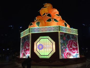 Illuminated light painting on wall at night