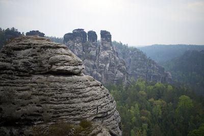 Rock formations on landscape against sky