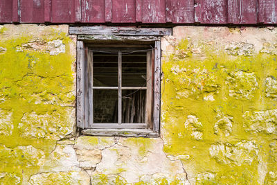 Vintage stone and weathered wood barn and window