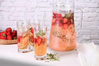 Strawberry summer cocktail or lemonade with thyme and lemon.  