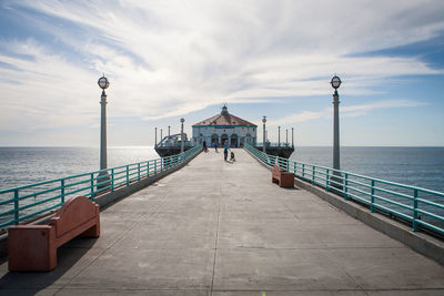 Pier over sea against sky