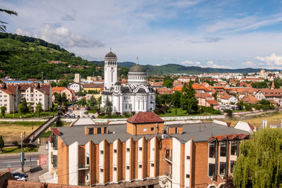 Buildings in city against sky