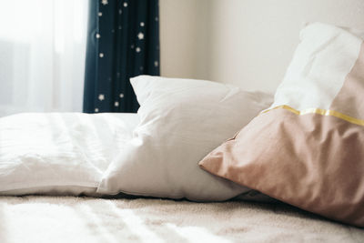 Close-up of blanket on bed at home