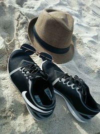 High angle view of shoes on sand