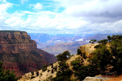 Scenic view of mountains against cloudy sky