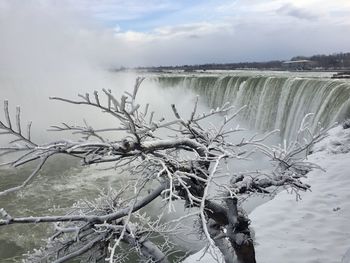 Scenic view of frozen lake against sky