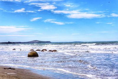 Scenic view of sea against cloudy sky