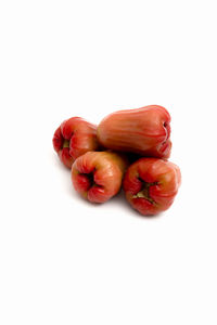 High angle view of cherries against white background