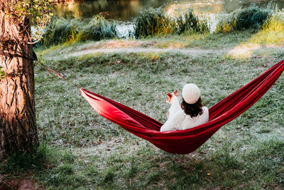 Woman relaxing on hammock