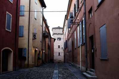 Street amidst residential buildings