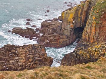 View of rock formation by sea