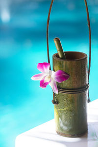 Bamboo natural cup with small bamboo tube, decorate with purple flower, tie together with vine