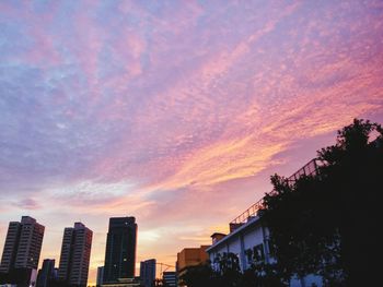 Low angle view of cloudy sky at sunset