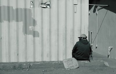 Full length of woman standing on wall