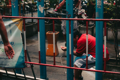 People playing on railing