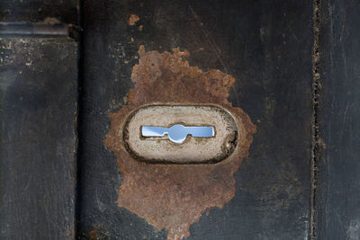 Directly above shot of rusty metal door