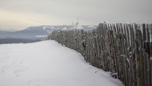 Scenic view of snow covered mountains against sky