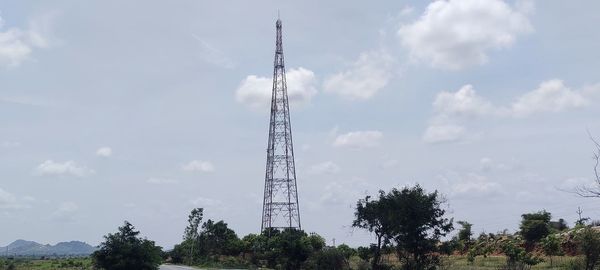 Low angle view of communications tower against sky
