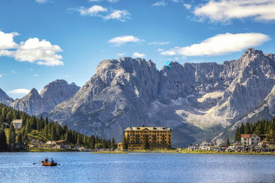 Scenic view of lake against cloudy sky