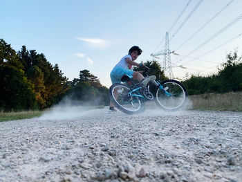 Man riding bicycle on street