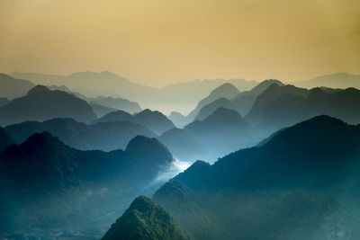 Scenic view of mountains against sky during sunset