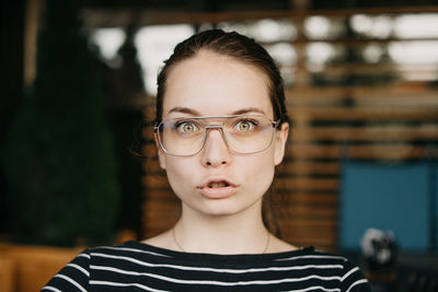 Portrait of beautiful young woman wearing eyeglasses